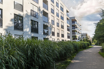 Fototapeta premium Cityscape of a residential area with modern sustainable apartment buildings, new green urban landscape in the city