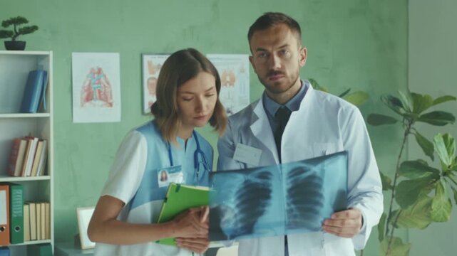 Doctors analyzing chest radiograph images, Healthcare professionals studying thoracic Xray scans carefully