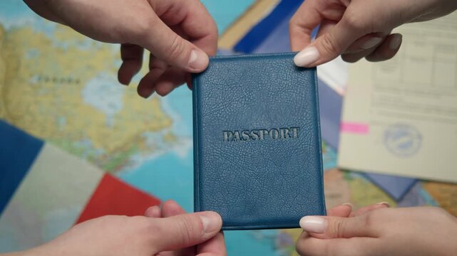Applicant seizes French passport after naturalization approval surrounded by EU stamps and tricolor.
