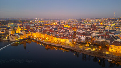 Fototapeta premium Sunset aerial view of Smetanovo nabrezi riverside in Prague, Cze