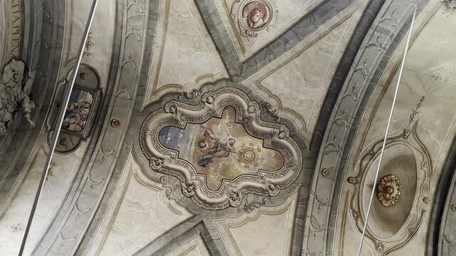 Rotating Shot of Baroque Church Ceiling with Ornate Fresco Angels Cherubs Stucco Decorations and Medallions in Limone sul Garda Italy 4K HDR