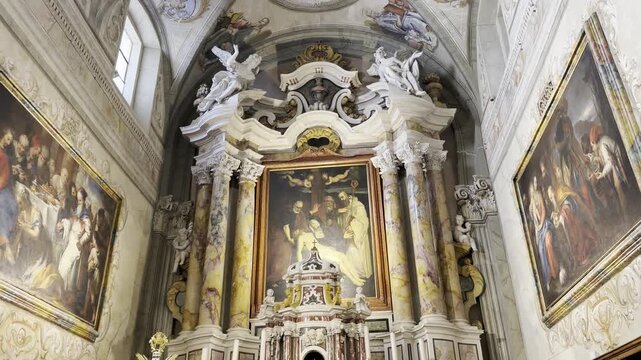 Baroque Church Interior with Ornate Altar Gold Cross Religious Paintings Marble Columns and Wooden Choir Stalls in Limone sul Garda Italy 4K HDR