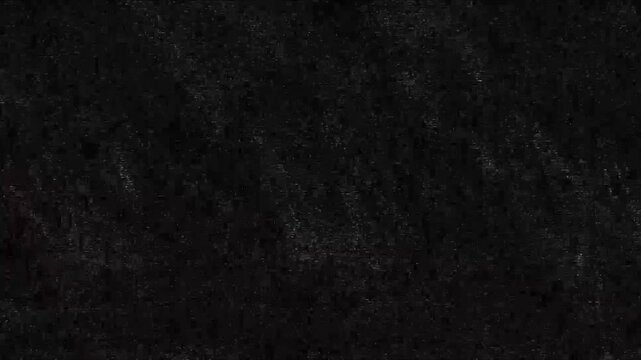 Dark grainy texture with subtle static noise and atmospheric black gradients. Ideal for cinematic overlays horror backgrounds or vintage film effects in video production.