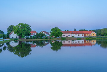 Fototapeta premium Sunset view of traditional south Bohemian village Holasovice, Cz