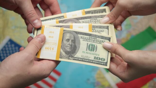 American mediator passes stack of dollars to Iranian black marketeer against world map with US and Iranian flags for currency black market.