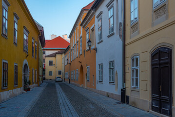 Fototapeta premium Sunrise view of a narrow street in Sopron, Hungary