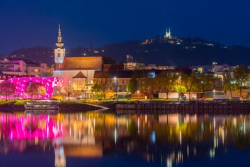 Obraz premium Sunset view of Ars Electronica center and Saint Joseph church in