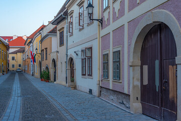 Fototapeta premium Sunrise view of a narrow street in Sopron, Hungary