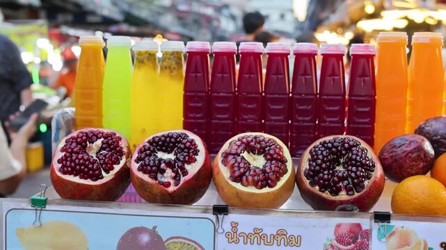 Street Food Fresh Fruit Juice Bottles and Pomegranate Display Bangkok Night Market
