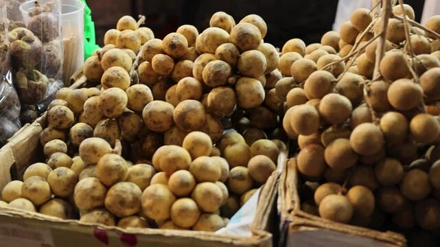 Street Food Fresh Longan Fruit Bundles Display at Bangkok Night Market