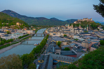Fototapeta premium Sunset view of Hohensalzburg fortress overlooking the old town o