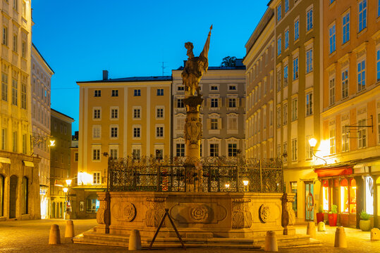 Sunset view of Saint Florian fountain in Salzburg, Austria