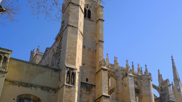 Narbonne gothic cathedral stone tower blue sky architectural details Europe