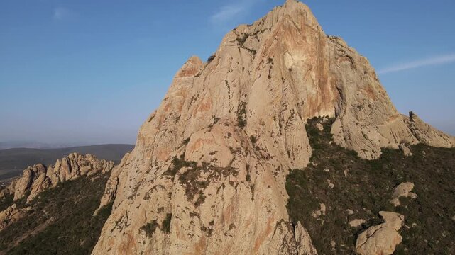 Drone Shot of Pe&ntilde;a de Bernal Giant Monolith in Mexico Landscape