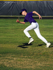 Obraz premium Summer League Baseball Player Wears Purple