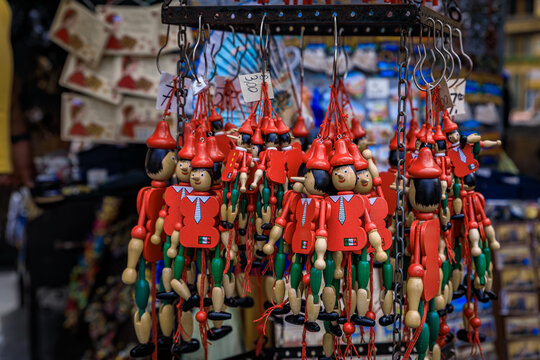 Colorful wooden Pinocchio puppets for sale at a souvenir shop in Florence, Italy