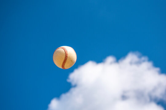 Baseball flying in winter sky