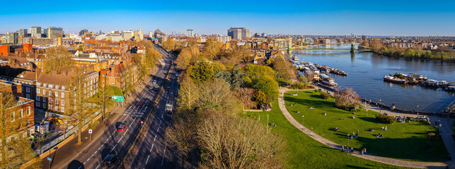 Hammersmith Bridge Over River Thames with London Skyline in Golden Light