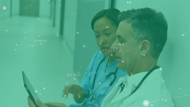 Overlay appearing, blue-scrub nurse tapping tablet while white-coat doctor nodding, confirming data