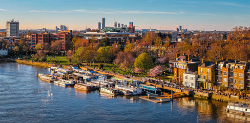 Fototapeta premium Houseboats Moored on River Thames in Hammersmith London Waterfront Scene