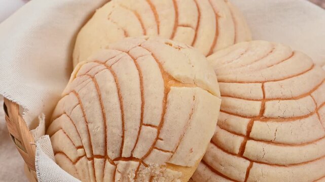 Close-up of fresh artisanal Mexican sweet bread with seashell pattern