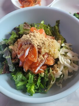 Korean Style Raw Trout Bibimbap (Hoe-deopbap) sith Bean Powder and Garlic