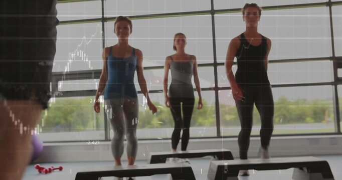 Instructor showing stepping from left, leading three women mirroring on step platforms for fitness