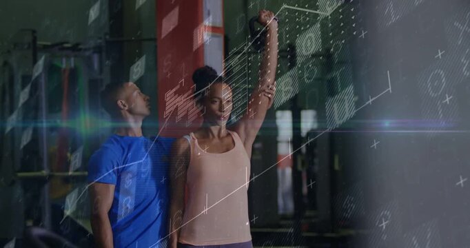 Coach stepping closer and woman lifting dumbbell overhead in gym, tech overlays tracking form