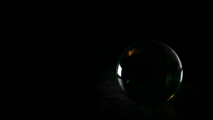 bola de cristal con fondo negro con espacio para texto Crystal ball isolated on black background with copy space © Logan