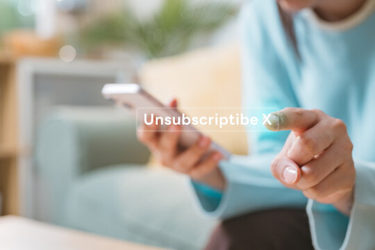 User canceling subscription on smartphone with digital unsubscribe interface, representing recurring billing control, account settings management and subscription service termination.
