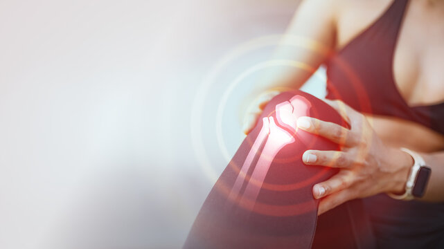 Female athlete holding painful knee with highlighted joint inflammation overlay. Represents sports injury, patellofemoral syndrome, orthopedic problem, workout strain, fitness risk.