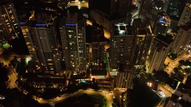 Kuala Lumpur, Malaysia - September 11, 2022: Aerial view of streets and skyscrapers in Kuala Lumpur city at night.