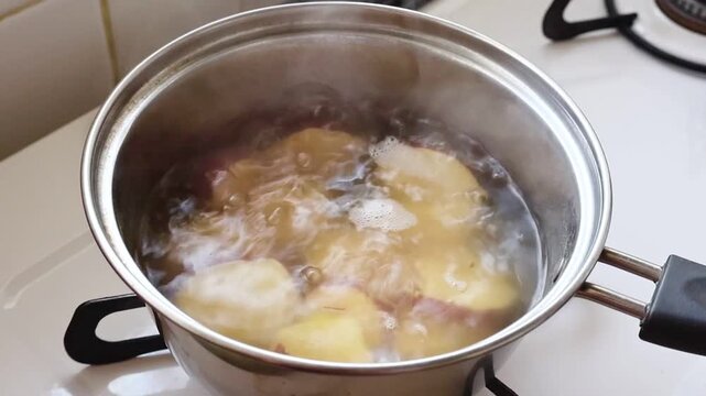 Boiling Sweet Potatoes in Cooking Pot Homemade Kitchen Scene	