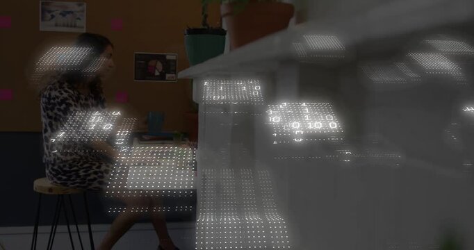 Woman at counter sipping mug and sorting notes, binary grid appearing from right, showing tech data