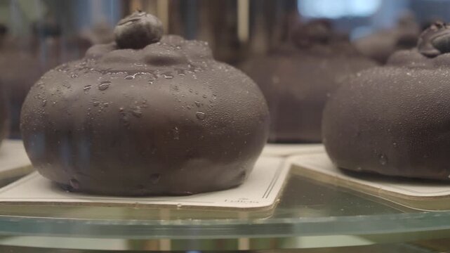 Chocolate treats displayed in a bakery case for customers