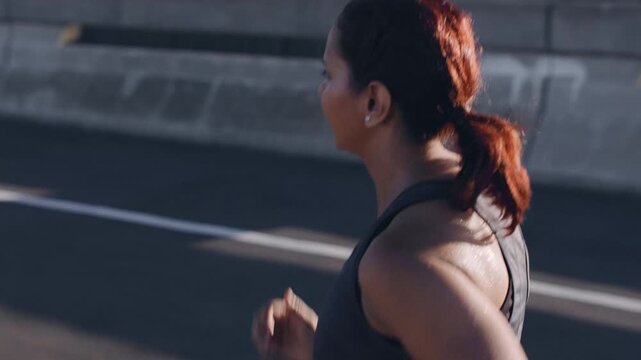 Running, fitness and woman in city, back and endurance for health benefits, sound or routine. Training, person and athlete in street, challenge or exercise for workout, wellness and album playlist