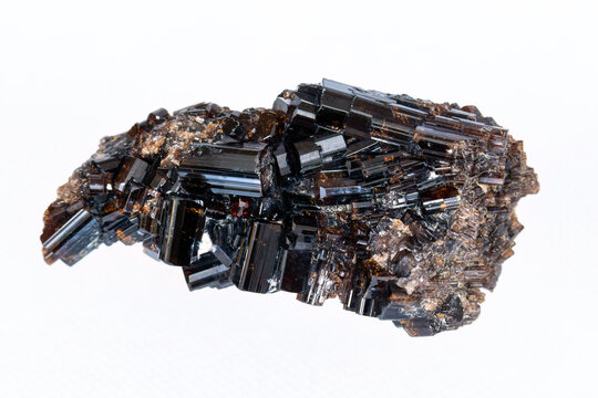 Mineral sample, cluster of brown vesuvianite crystals. On white background. 
