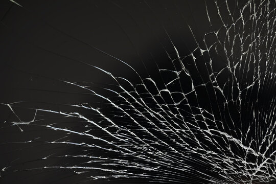 Art of wrinkles and cracks of glass caused by smashing and falling bumps. isolated on black background, This crack can be used as a pattern