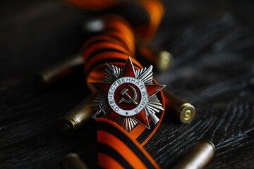 Fototapeta premium Patriotic War Order and battle order for courage and bravery on George Ribbon background for the great day of Victory (russian text: Patriotic War)