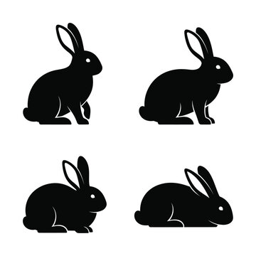 Four silhouettes of rabbits in different positions as vectors