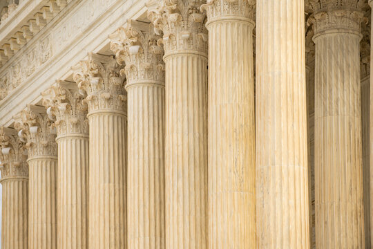 Columns architectural heritage marble exterior. Columns repetition symmetry texture. Columns decorative capitals ornament elements. Columns neoclassical structure design.