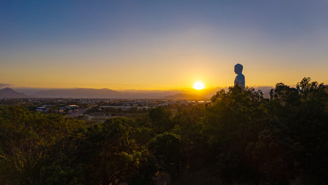 Standing Buddha statue at sunset Tong Lam Son Temple Nha Trang Vietnam