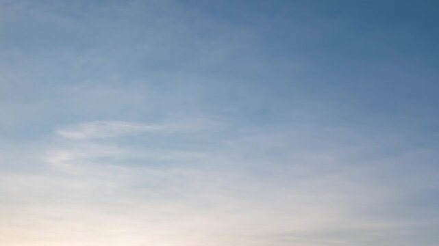 Beautiful evening clouds time-lapse, soft purple and pink sky background.