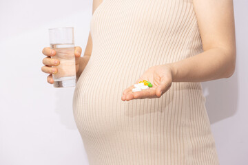 Obraz premium Pregnant Woman Taking Medication
