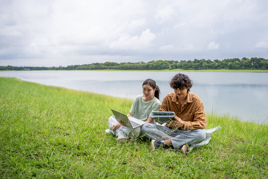 Asian young couple spend time on a romantic date in the outdoors garden. 
