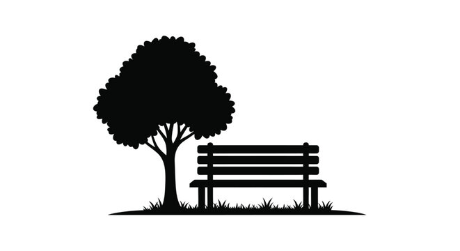 A solitary park bench rests beneath a leafy tree silhouette
