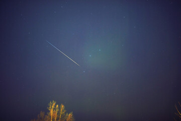 Fototapeta premium Aurora borealis, polar lights with Milky Way stars.