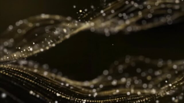 Elegant, shimmering golden and silver-white particles, light sparks, and starbursts gracefully drift in fluid patterns against a deep black void with motion blur and depth of field, concept of