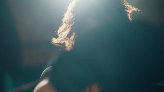 Portrait of pretty african woman when boxing in ring, fight, slow motion. Intense cardio workout or competition, boxing match, professional female fighter or athletic lady training in gym, fitness