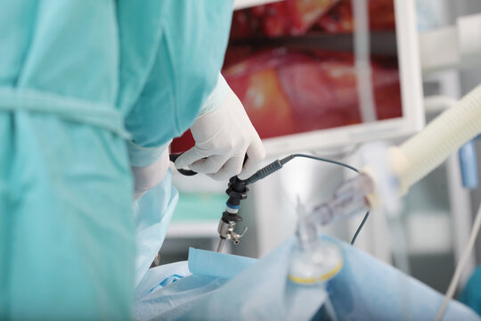 Laparoscopic surgery. Laparoscopic instruments in hands of surgeon. Operations on internal organs. Minimally invasive surgery. Modern surgical method.